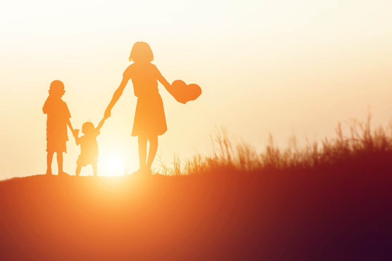 Silhouettes of happy parents having good time
